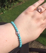 Load image into Gallery viewer, Turquoise bracelet with sterling silver knot charm
