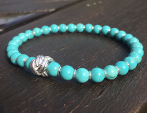 Turquoise bracelet with sterling silver knot charm